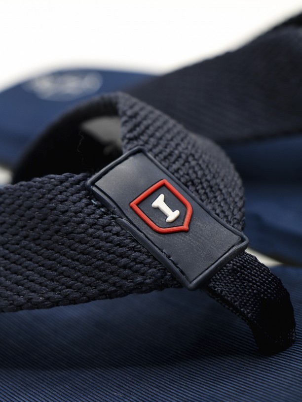 Plain-colored flip flops with logo