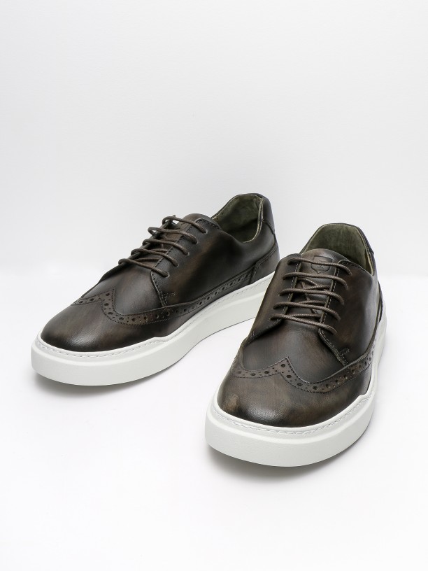 Leather sneakers with pricked detail