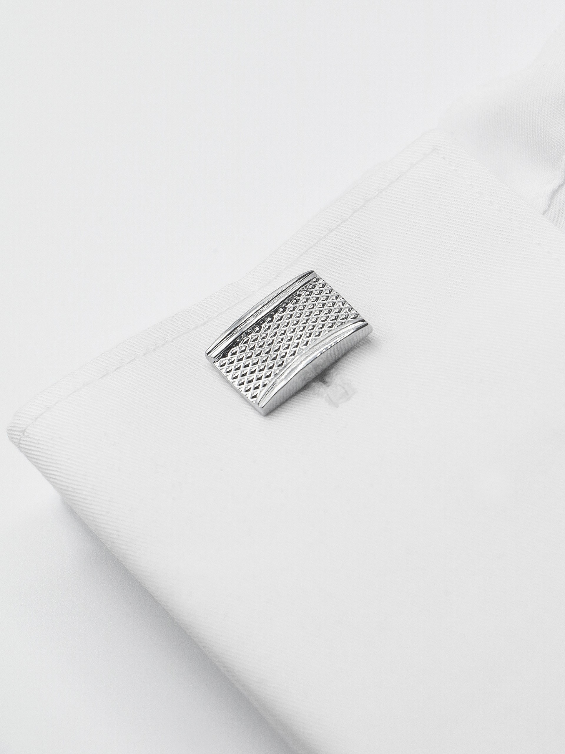 Botões de punho metálicos