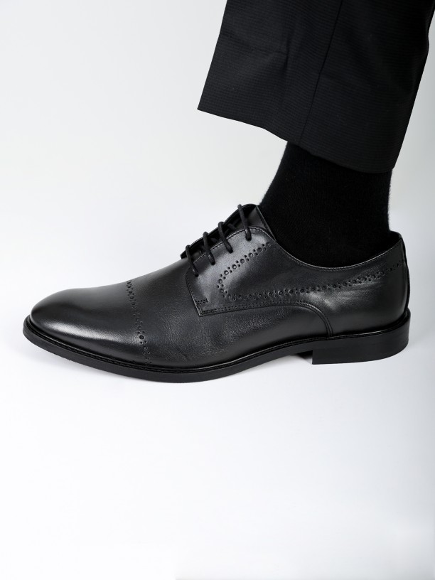 Zapato elegante liso de piel