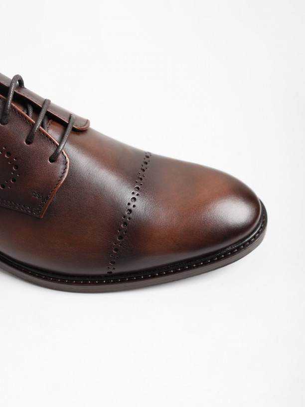 Zapato elegante liso de piel