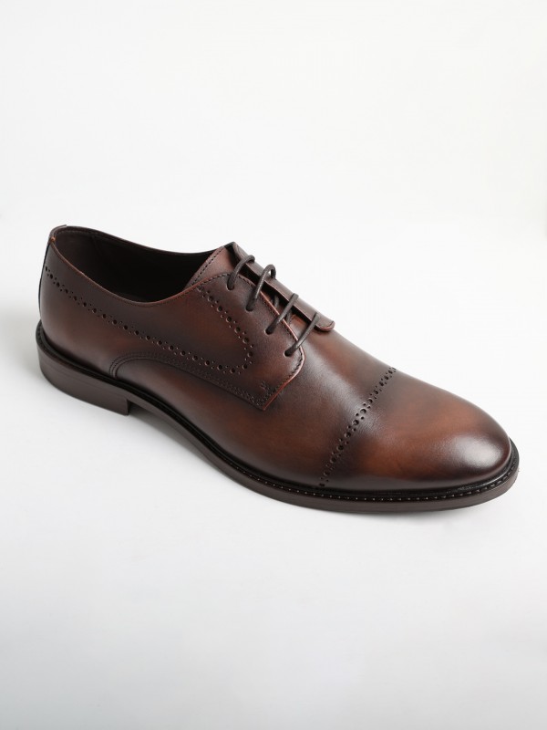 Zapato elegante liso de piel