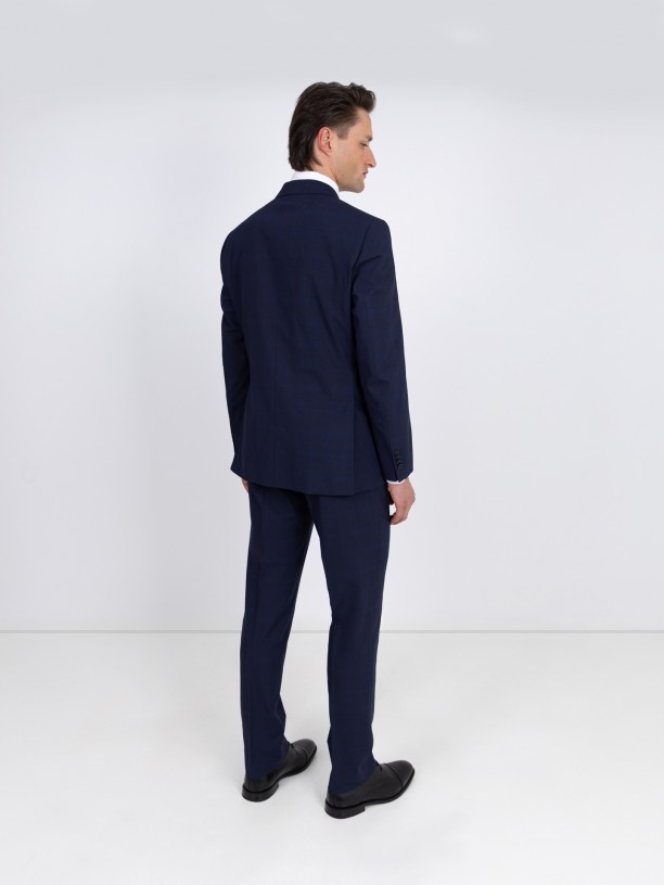 Double-breasted suit with a checkered pattern Double-breasted suit with a checkered pattern