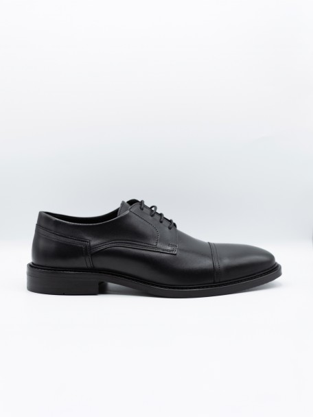 Sapato elegante de pele