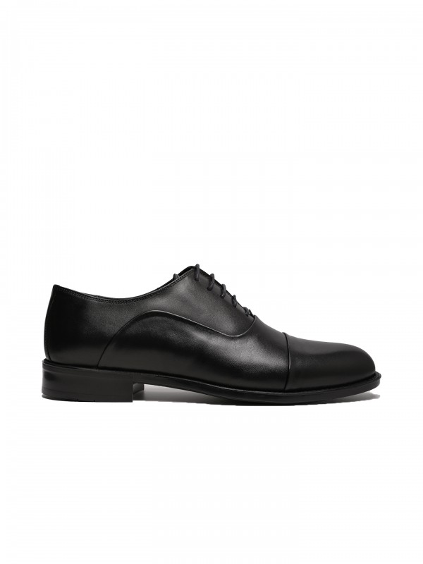 Sapato elegante de pele
