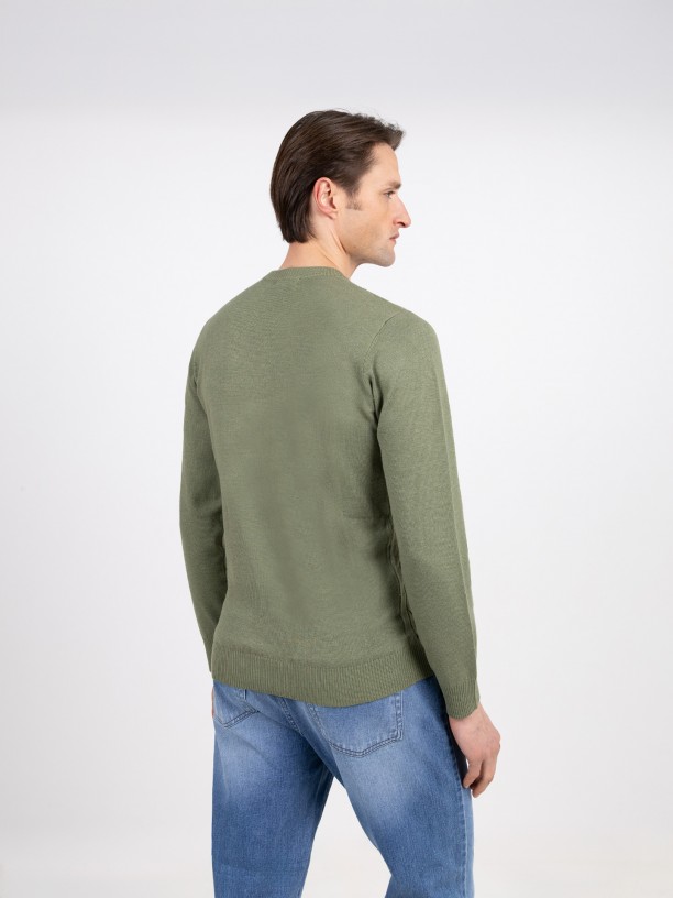 Knit sweater with a braided effect