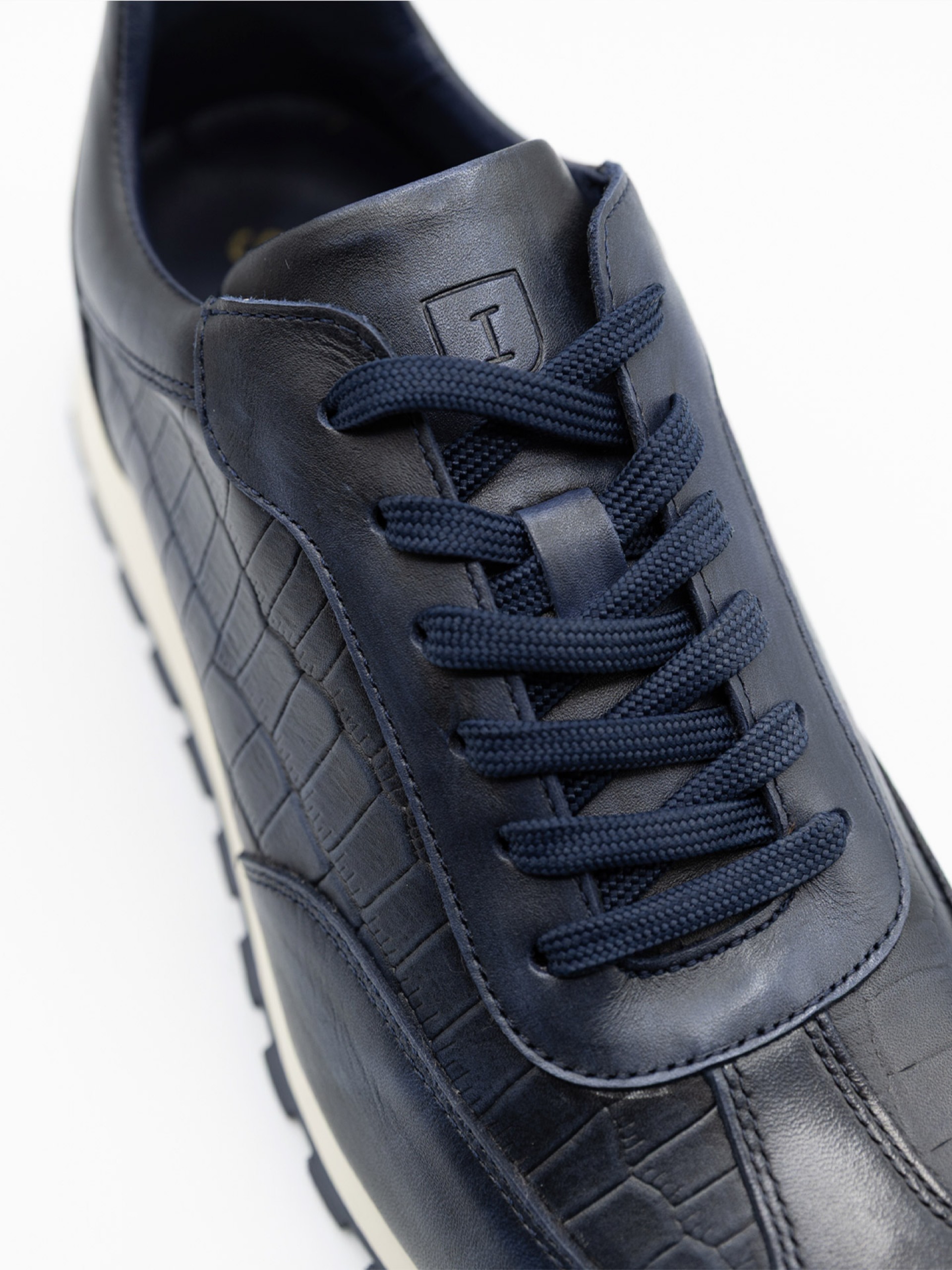 Polished leather sneaker