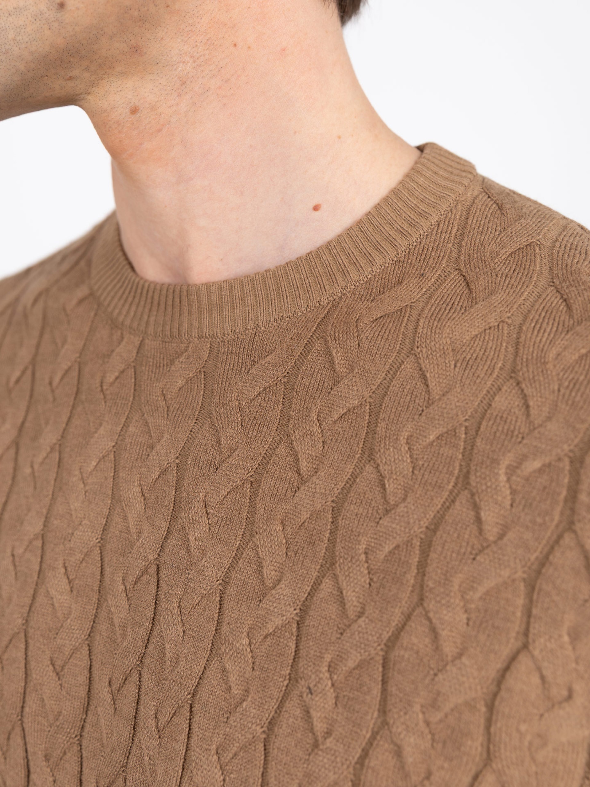 Knit sweater with a braided effect