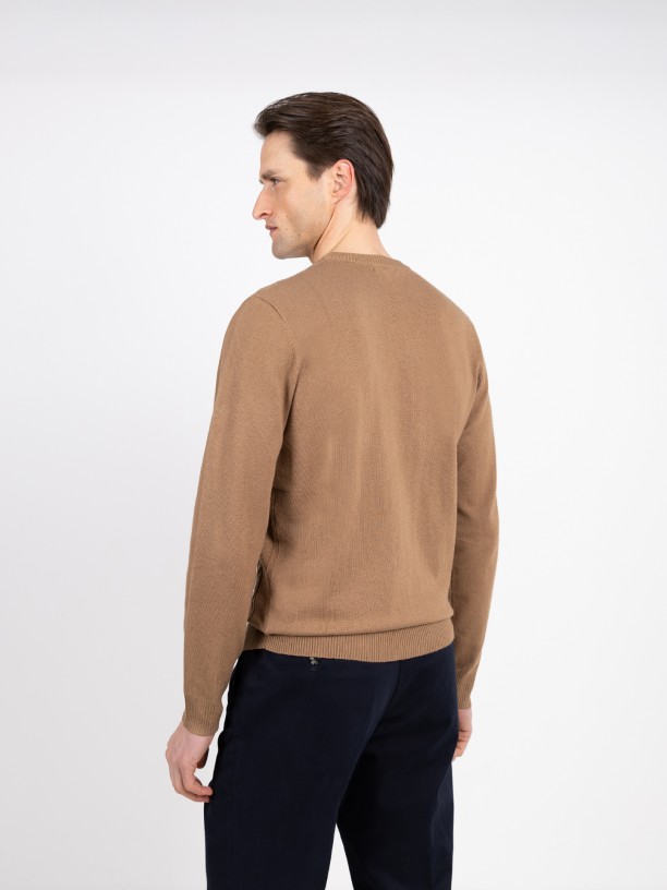 Knit sweater with a braided effect